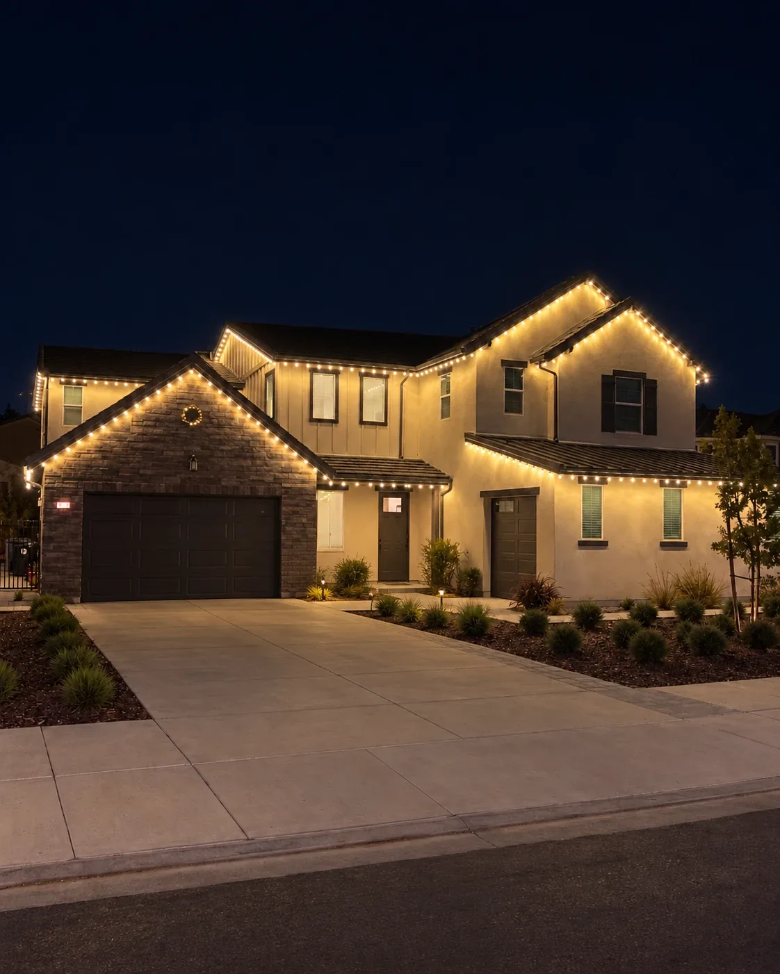 Two-story home outlined in warm white C9 Christmas lights by Aurix