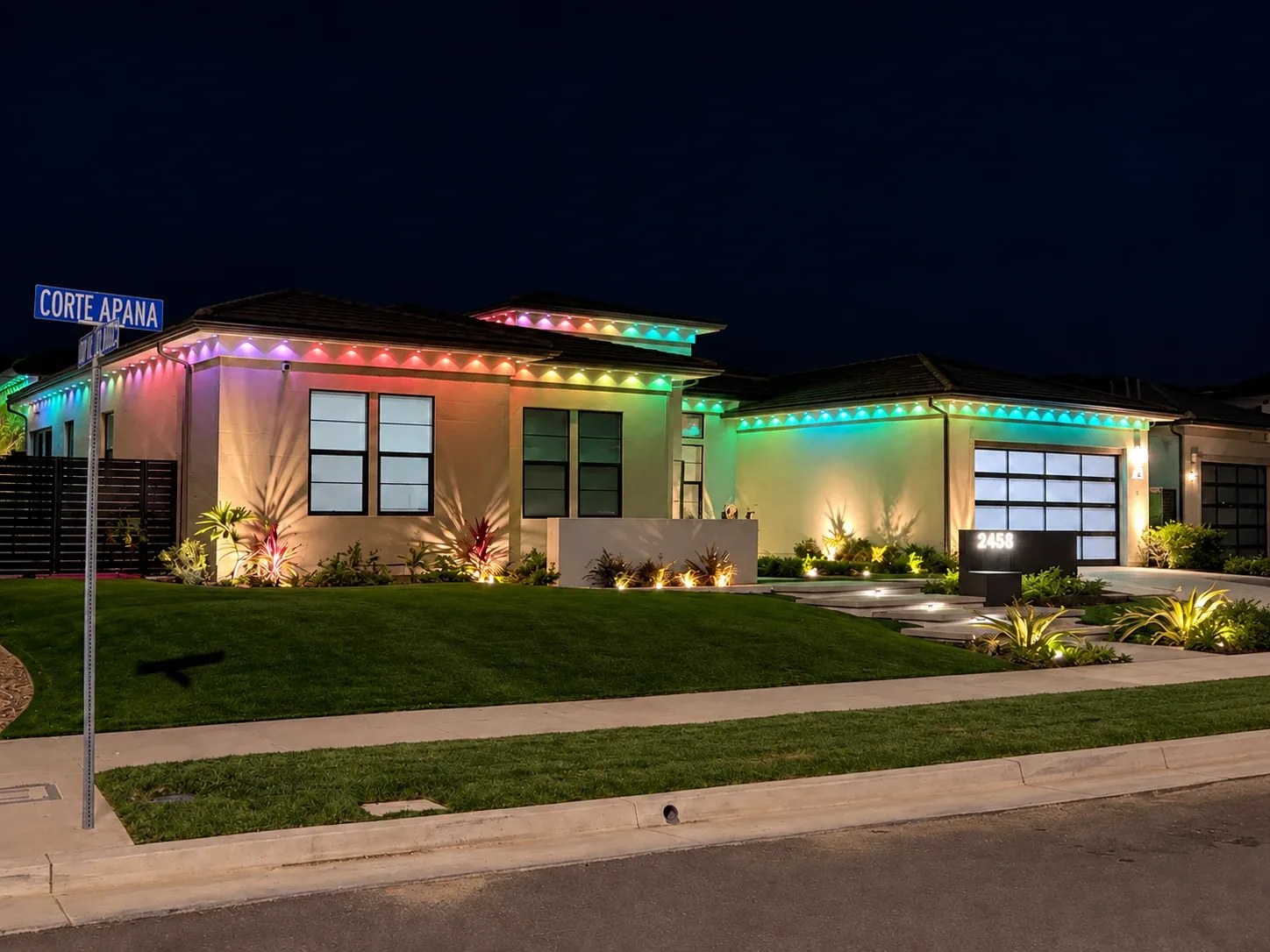 Aurix permanent lighting running a multi-color scene along the eaves